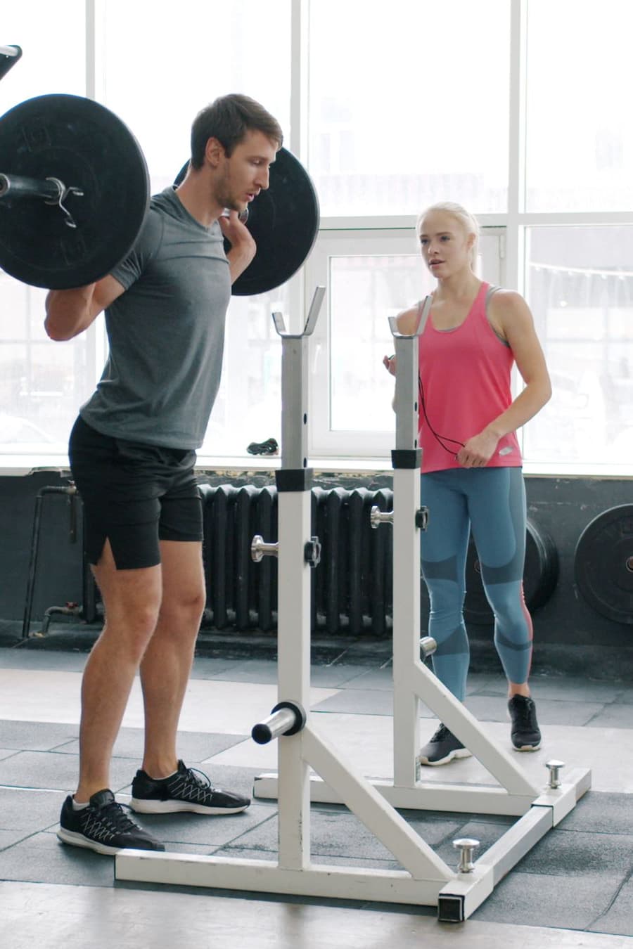 A loaded barbell back squat in the studio